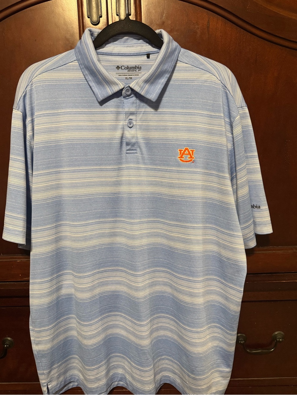 Columbia Light Blue and White Striped Polo with Orange Auburn Logo